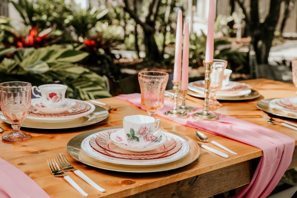 This fairytail place setting takes place in the gardens of The Carriage House in downtown St. Augustine. The Carriage house is perfection for my garden lovers filled with a fairytail style garden with pixie lights and a small bridge perfect for photos.