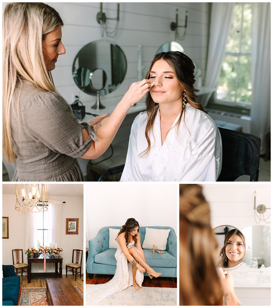 A brunette bride in a white satin robe has her makeup done in the shiplap  covered bridal suite at La Venture Grove, Florida wedding venue taken by Laura Perez Photography.