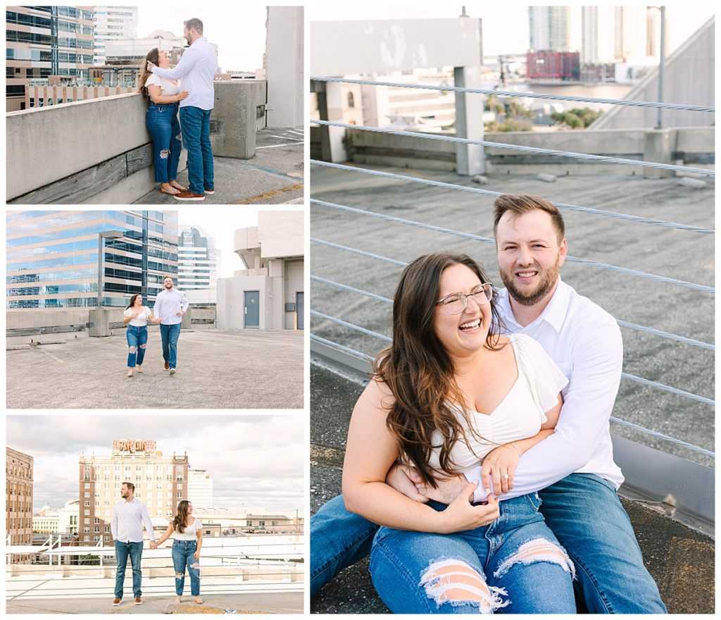 An engaged couple hold hands and laugh during a rooftop photography session with Laura Perez Photography.