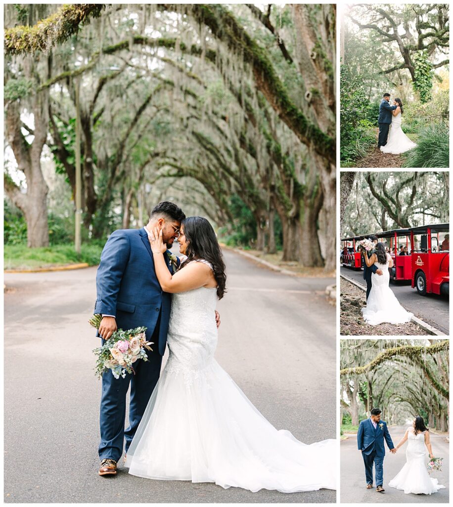 Newlyweds in a wedding gown and blue suit embrace beneath the Spanish Moss covered trees on Magnolia Ave in STA. 