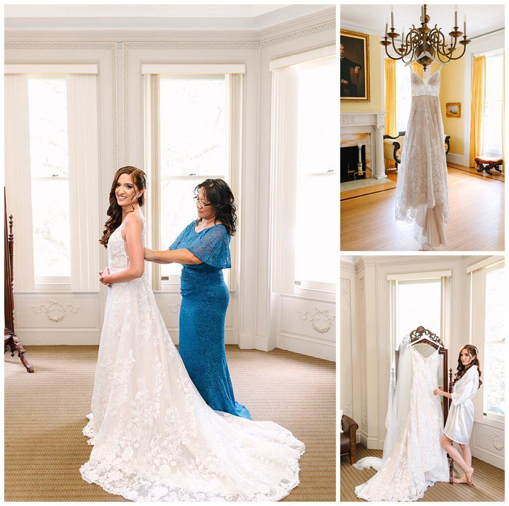 A Florida bride is photographed next to her lace, A-line wedding gown as her mother, wearing a blue, floor length lace dress assists her with the back.