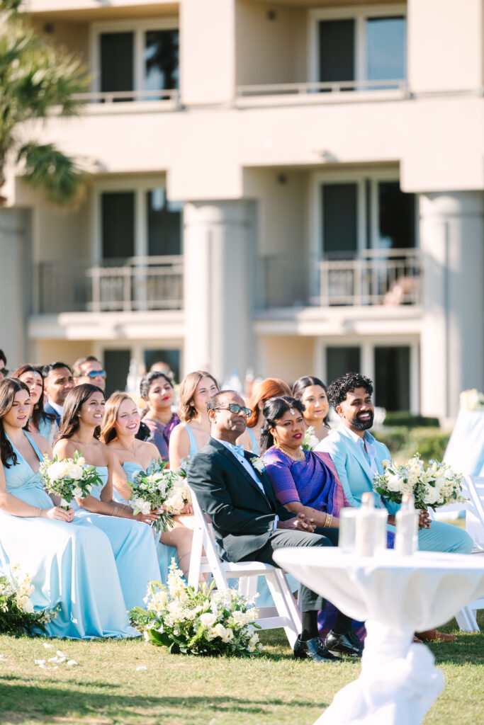 Elegant bride and groom sharing an emotional first look in a sunlit courtyard, captured in a timeless, editorial style that highlights genuine emotion, luxury details, and heirloom-quality imagery for couples who value storytelling through fine art photography.