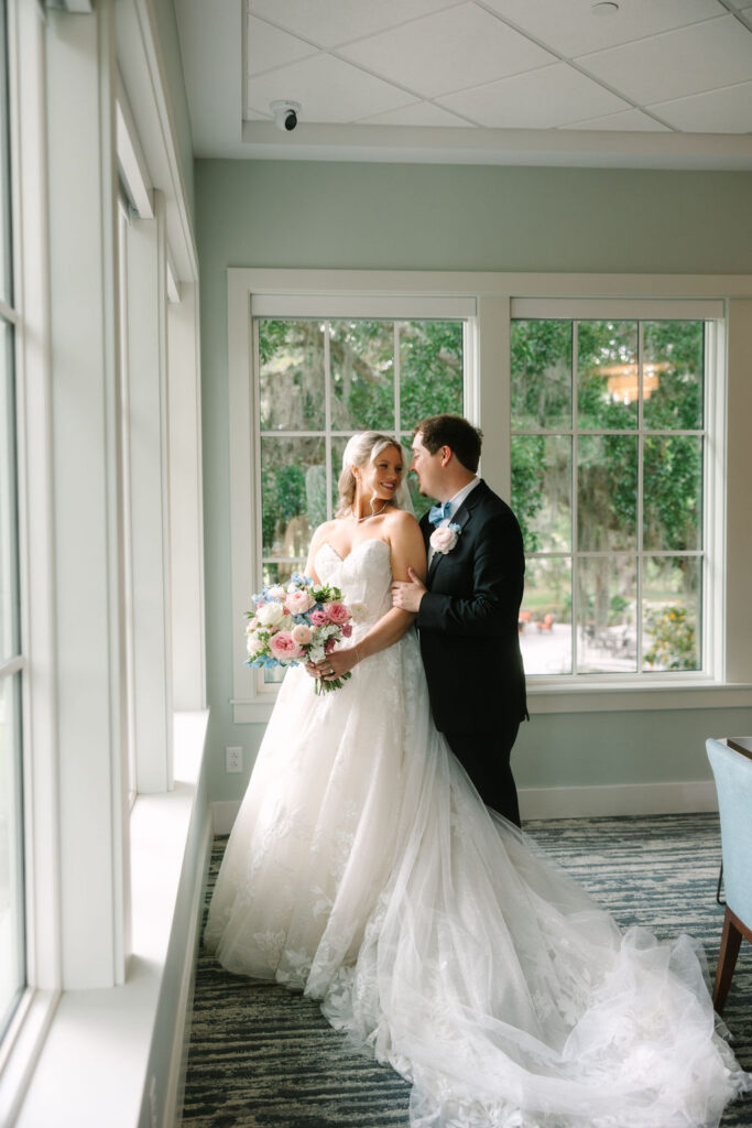 Bride and groom sharing a portrait inside The Oaks at Amelia Island wedding venue in Fernandina Beach, Florida.