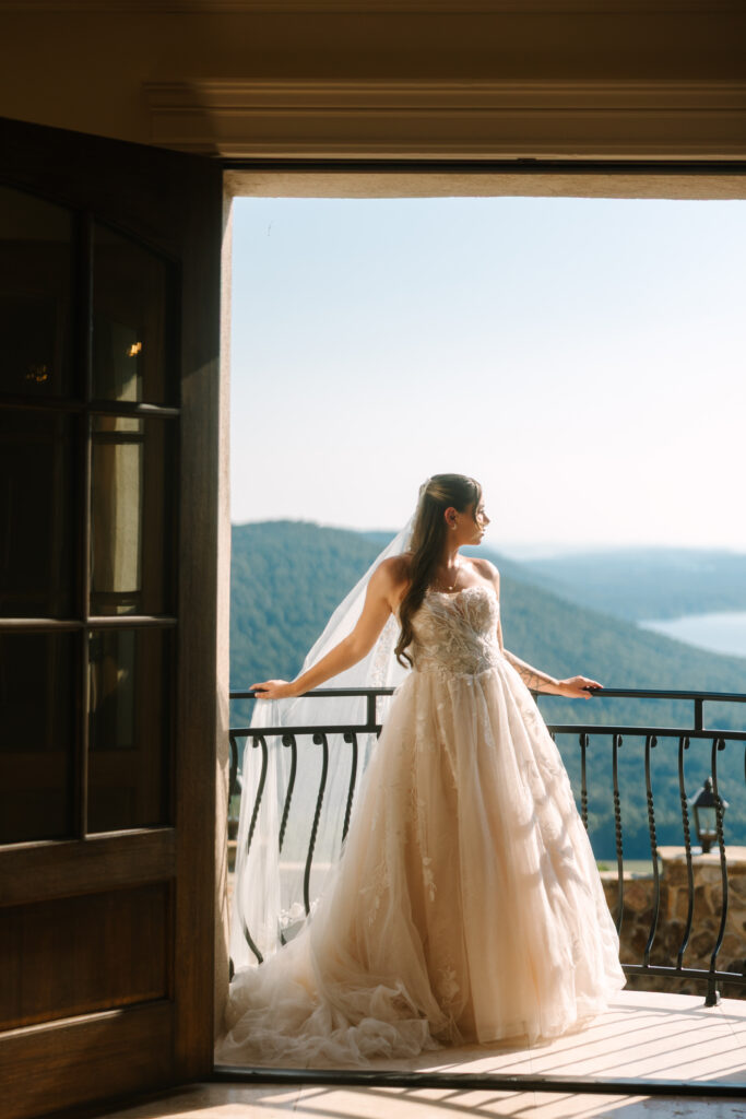 Bridal portrait against Stone Haven's stone archways and staircase