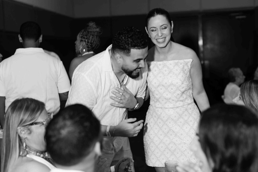 couple laughing with family and friends in riviera maya mexico 